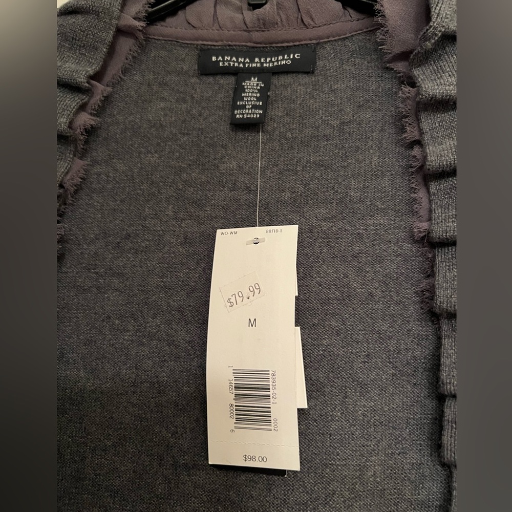 100% Merino wool cardigan with hand beaded detailing, never worn